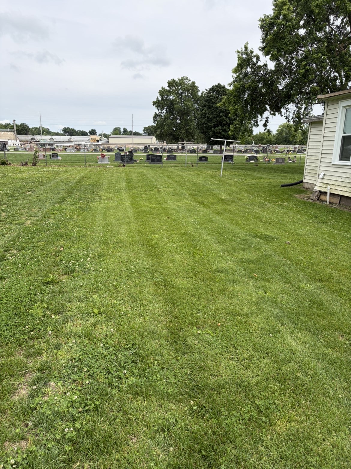 Striped lawn beside cemetery